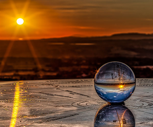 a sundial at millennium point at sunset